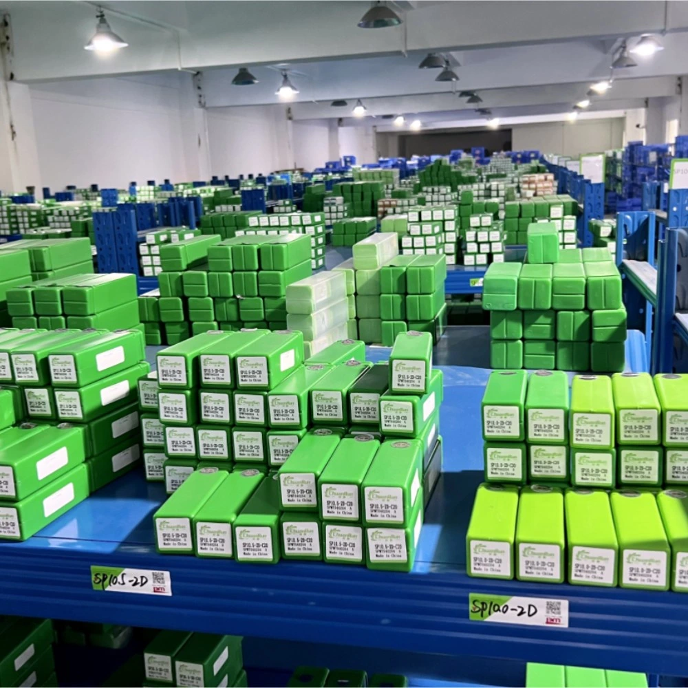 Wide view of tool storage shelves and labelled product boxes.
